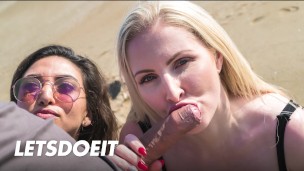 Latin MILF beach threesome shared cock