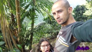 Latina with glasses and big tits gives a blowjob outdoors